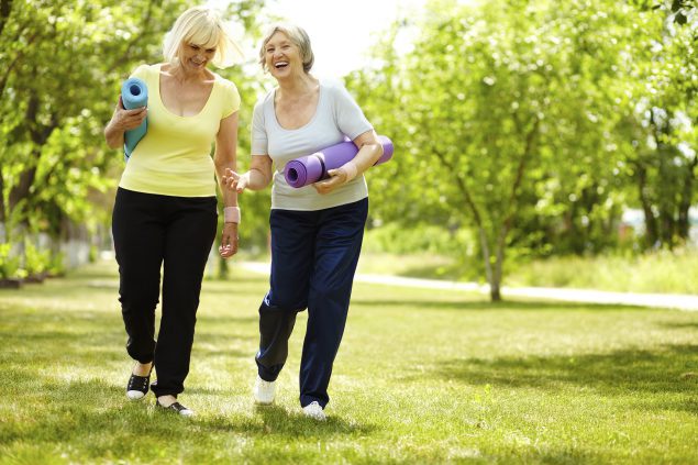 Two women exercising together.