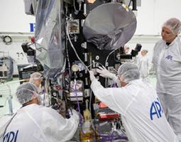 The plaque containing names submitted to travel to the Sun is mounted below Parker Solar Probe’s high-gain antenna (the round object with gray covering), which the spacecraft will use to transmit data back to Earth.