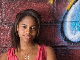 photograph of a young woman smiling