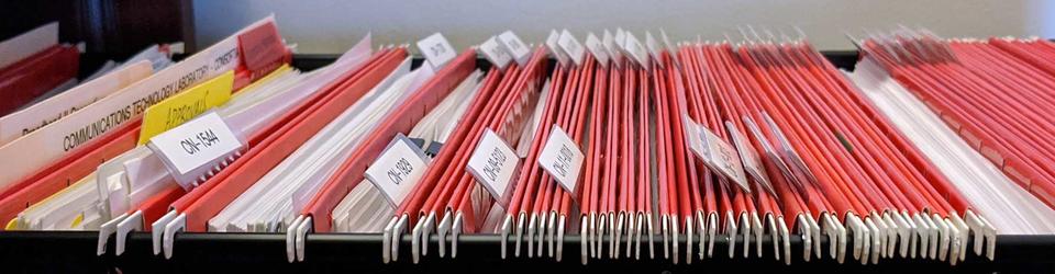 Banner image showing folders inside a cabinet