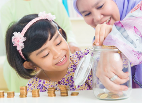two girls counting coins from a jar