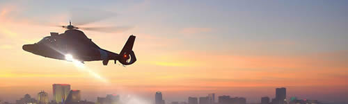 Helicopter flying above a city