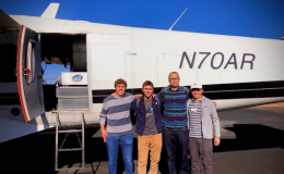 Photo of some members of the WASSR team loading science gear onto an aircraft