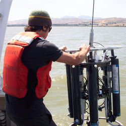 hydrologist working with measuring equipment