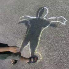 Chalk outline of boy's shadow