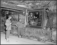 Soldiers viewing recovered looted artwork.