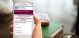 cell phone with NCCDPHP Success Stories login page