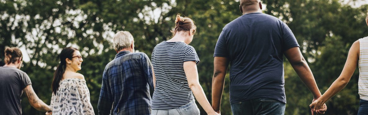 photo of people holding hands