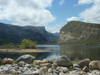 Photo of river flowing between two cliff faces