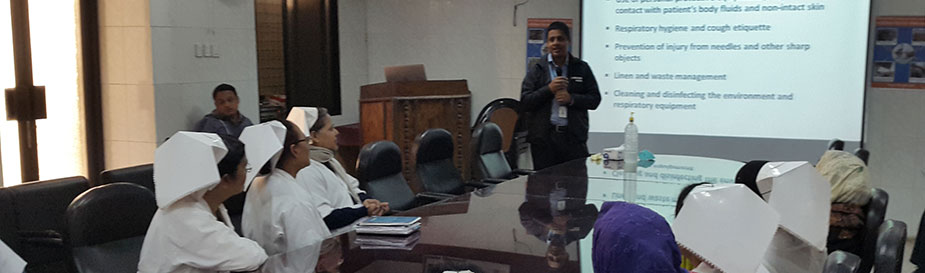 In December 2014, to strengthen hospital infection control while caring for patients with Nipah virus encephalitis and other infectious diseases, FETP Bangladesh resident Dr. Mallick Masum Billah trains nurses at Rajshahi Medical College Hospital in Rajshahi, Bangladesh on hospital infection control standards and transmission precautions. 