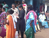 A field epidemiologist takes notes at a flood relief camp in Kerala, India.