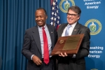 Secretary of Housing and Urban Development Ben Carson receives In Appreciation Award from Secretary of Energy Rick Perry