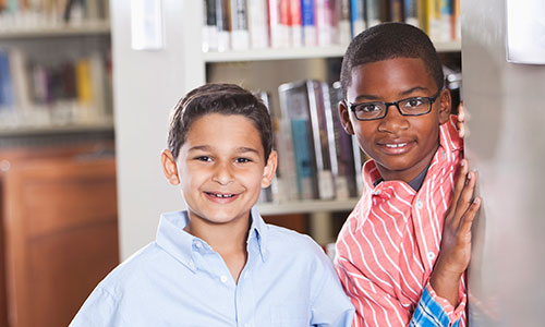 School age children in the library