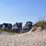 Beach houses behind a sand dune at Cape Hatteras, North Carolina