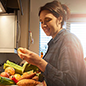 woman looking at food in delivery meal kit box