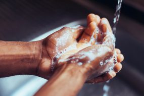 Hands washing with soapy water