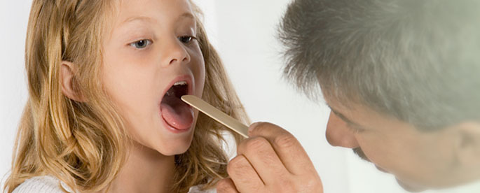 Physician examining young patient