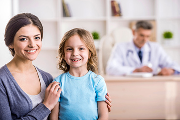 girl and mom at doctors office