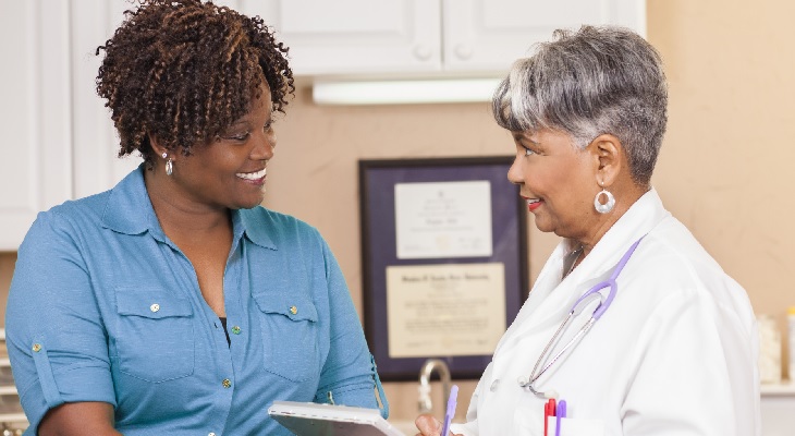 Photo of a doctor talking to a patient