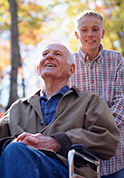 grandson and grandparent in wheelchair