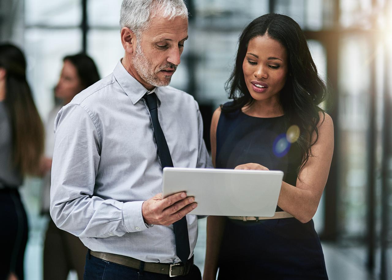 Employer and colleague discuss file