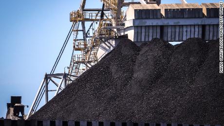 A bucket-wheel reclaimer stands next to a pile of coal at the Port of Newcastle in Newcastle, New South Wales, Australia, on Monday, Oct. 12, 2020. Prime Minister Scott Morrison warned last month that if power generators don&#39;t commit to building 1,000 megawatts of gas-fired generation capacity by April to replace a coal plant set to close in 2023, the pro fossil-fuel government would do so itself. Photographer: David Gray/Bloomberg via Getty Images