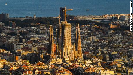 BARCELONA, SPAIN - JULY 18: A view of La Sagrada Familia stands over residential buildings during the first day the new Catalan government recommendations and regulations on the fight against COVID-19 take effect on July 18, 2020 in Barcelona, Spain. The Catalan capital&#39;s five million residents have been advised to stay home after the number of Coronavirus cases spiked in the past week. (Photo by David Ramos/Getty Images)