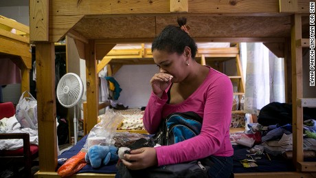 EL PASO, TEXAS - May 25, 2016: &quot;When she gave me the bear, she told me she would always be with me,&quot; Yadira Lozano Odio, 31, said, her eyes welling up with tears as she described the moment she said goodbye to her best friend in Santiago de Cuba. Lozano keeps a necklace wrapped around the small stuffed panda — a gift from another close friend. The necklace, she said, was blessed by a priest in her friend&#39;s church.                        At the Ysleta Lutheran Mission Human Care, CEO, Pastor and Director Rev. Karl Heimer, welcomes Cubans to stay in his shelter. &quot;These are people who are professionals and they will add to our society,&quot; Rev. Heimer, a Cuban himself, said.  Hundreds of Cuban refugees have been pouring into El Paso, Tex. daily, arriving by plane into Juarez, Mexico and walking across the border to El Paso. The flights began on May 9, and ceased on May 25, 2016. Ilana Panich-Linsman for CNN.com