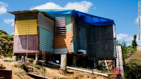 Herminio Trinidad Agosto&#39;s home in Corozal, P.R., on March 13, 2018. On Feb. 13, 2018, Zoraida Santiago Torres, 58, TrinidadÕs wife died from a pulmonary disease. The family, including two sons of Santiago, live in home made with the scraps of what was left after hurricane Maria flattened the house at a hill top of Corozal. Almost six months after hurricane Maria ravaged the island over 200 thousand people remain without power. Some recent deaths have been linked to the lack of electric service, but most are not recognized as a hurricane Mara death. (Erika P. Rodriguez for CNN) 