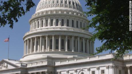 An American flag flies at the U.S. Capitol building.