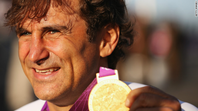 Alex Zanardi proudly displays the gold medal he won at the 2012 London Paralympics in the Individual H4 Time Trial.