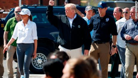 President Donald Trump and first lady Melania Trump tour areas affected by Hurricane Michael, Monday, Oct. 15, 2018, in Lynn Haven, Fla. (AP Photo/Evan Vucci)