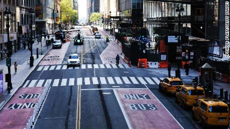 NEW YORK CITY- MAY 12: Usually one of the most congested streets in Manhattan, 42nd Street stands nearly empty on May 12, 2020 in New York City. Across America, people are reeling from the loss of jobs and incomes as unemployment soars to historical levels following the COVID-19 outbreak. While some states are beginning to re-open slowly, many business are struggling to find a profit with the new restrictions and a population that is fearful of the contagious virus.  (Photo by Spencer Platt/Getty Images)