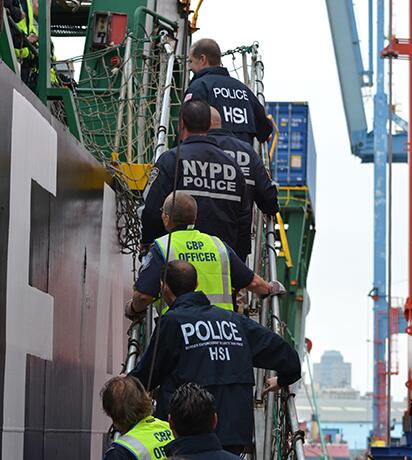 HSI Agents at a port with CBP Officers and the NYPD Police