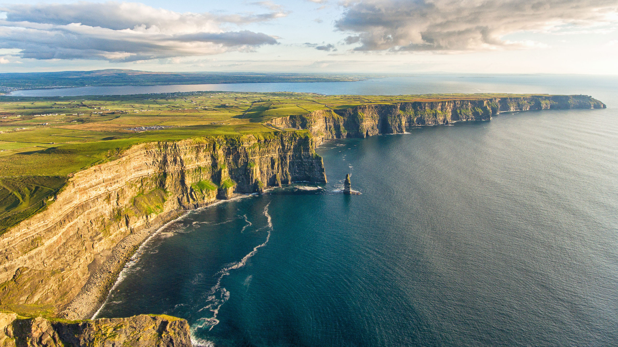 Aerial birds eye drone view from the world famous cliffs of moher in county clare ireland. Scenic Irish rural countryside nature along the wild atlantic way and European Atlantic Geotourism Route - Image [Shutterstock]