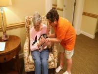 Michelle Videlock interacts with a resident 