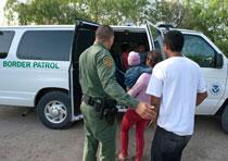 Agents escorting illegal aliens