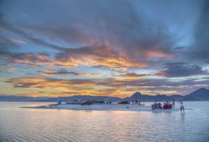 Visitors to the Bonneville Salt Flats in UT look over the Great Salt Lake. Photo by Bob Wick.