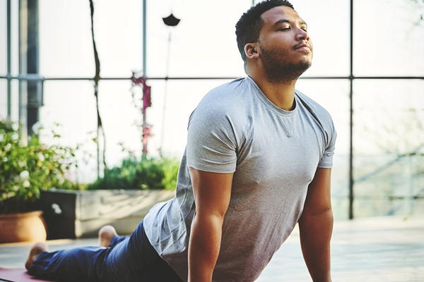 man practicing yoga