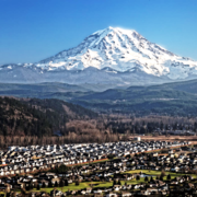  A distant view of Mount Rainier volcano over Puyallup Valley, near Orting, Washington.