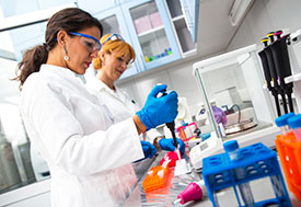 Photo by PointImages/iStock/Thinkstock. Two female scientists researching in laboratory.