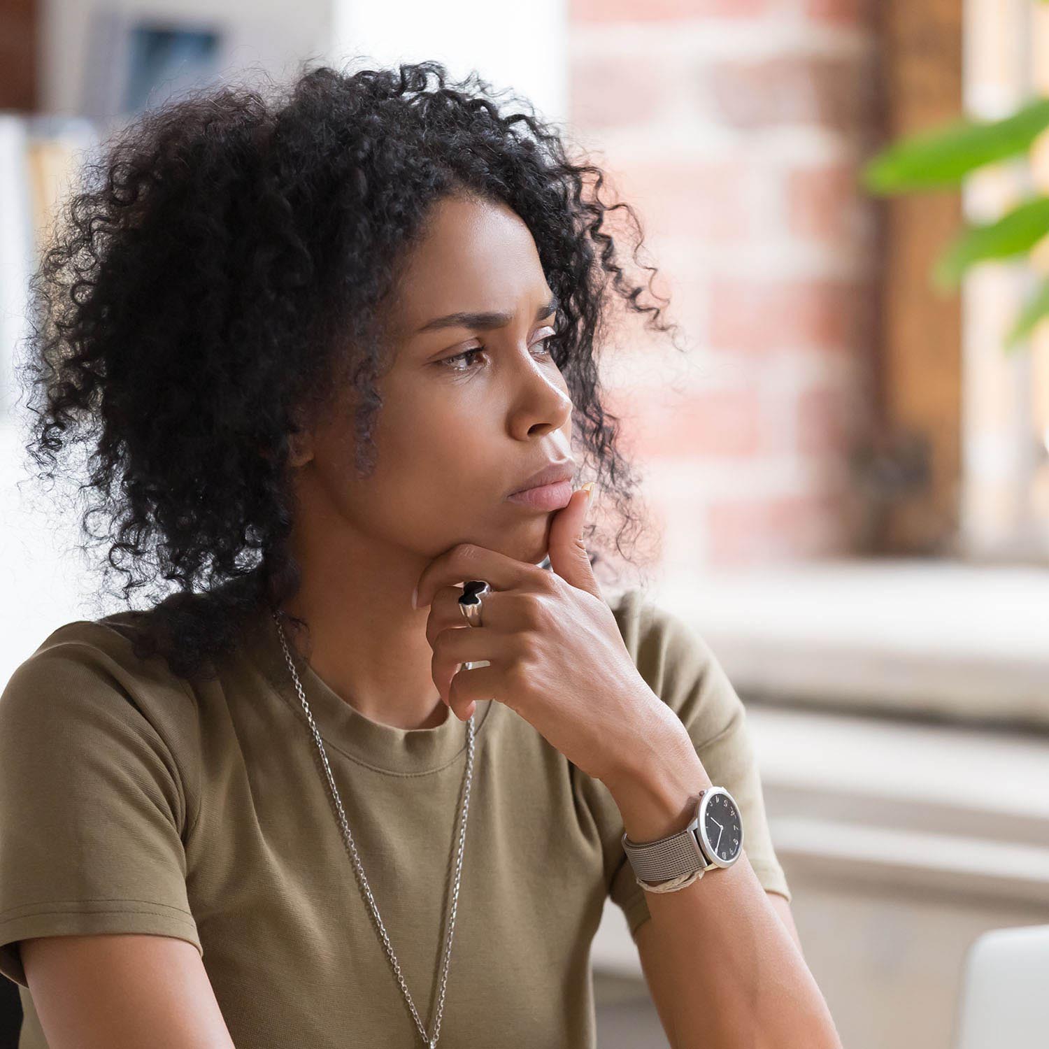 African American woman looking contemplative