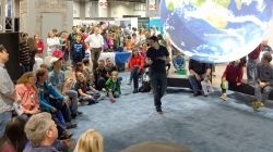 Meteorologist Tom Di Liberto presents on NOAA's Science On a Sphere at the 2016 USA Science and Engineering Festival.