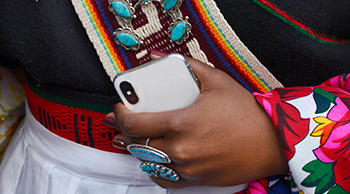 Native American Woman Holding a Smartphone