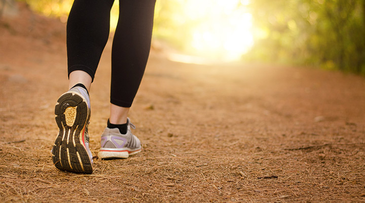 person walking on trail