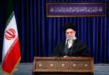 Ayatollah Ali Khamenei speaking behind lectern (© Office of the Iranian Supreme Leader/AP Images)