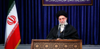 Ayatollah Ali Khamenei speaking behind lectern (© Office of the Iranian Supreme Leader/AP Images)